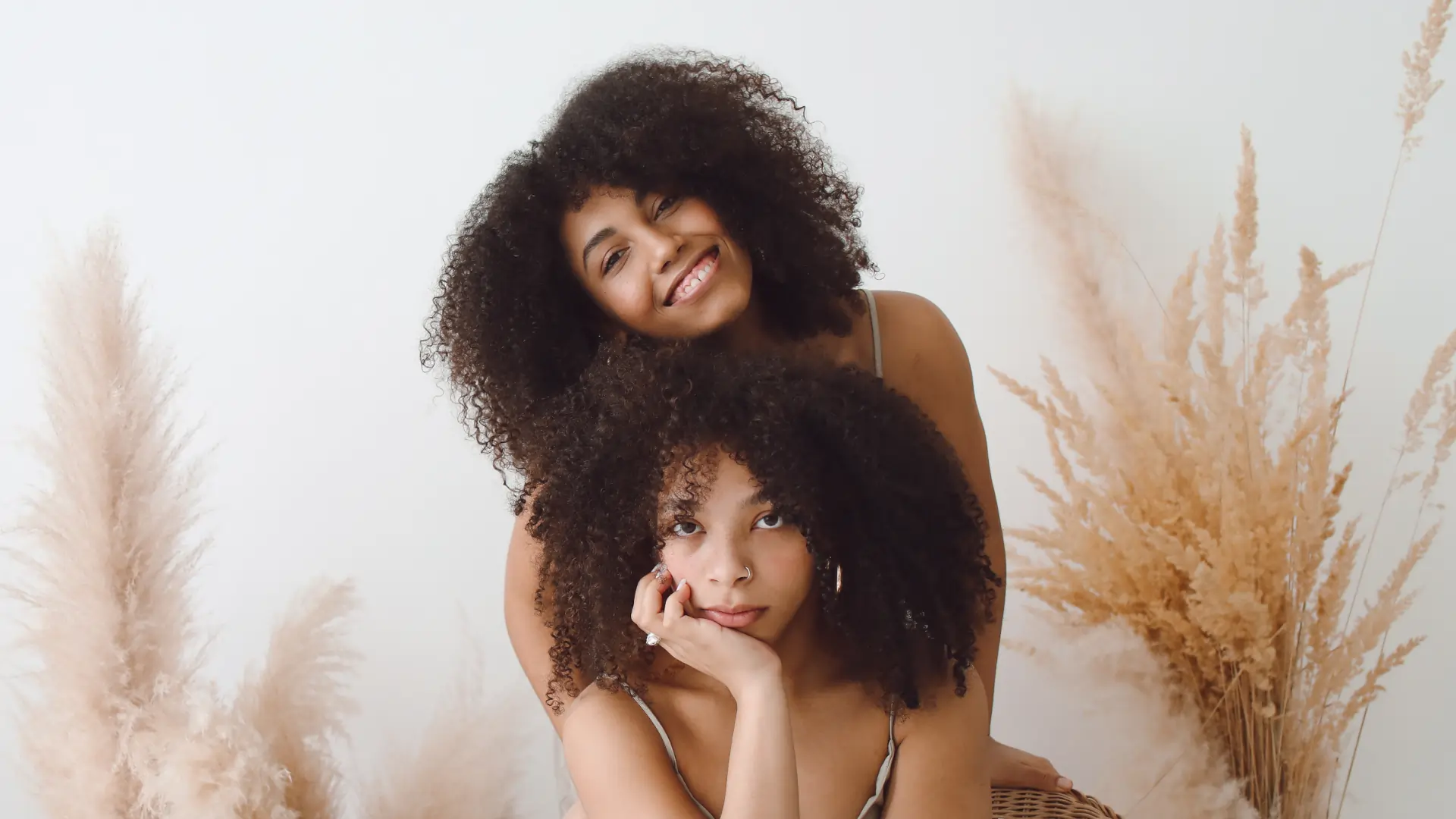 Two women with natural afro-textured hair